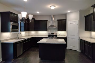 dark and light countertop island from Capitol Homes