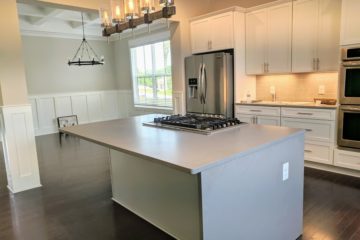 white farmhouse kitchen with island seating from Capitol Homes