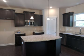 classic open space kitchen and island from from Capitol Homes